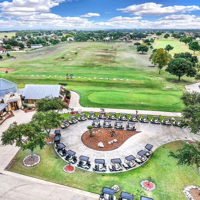 Golf carts staged around the clubhouse for an event